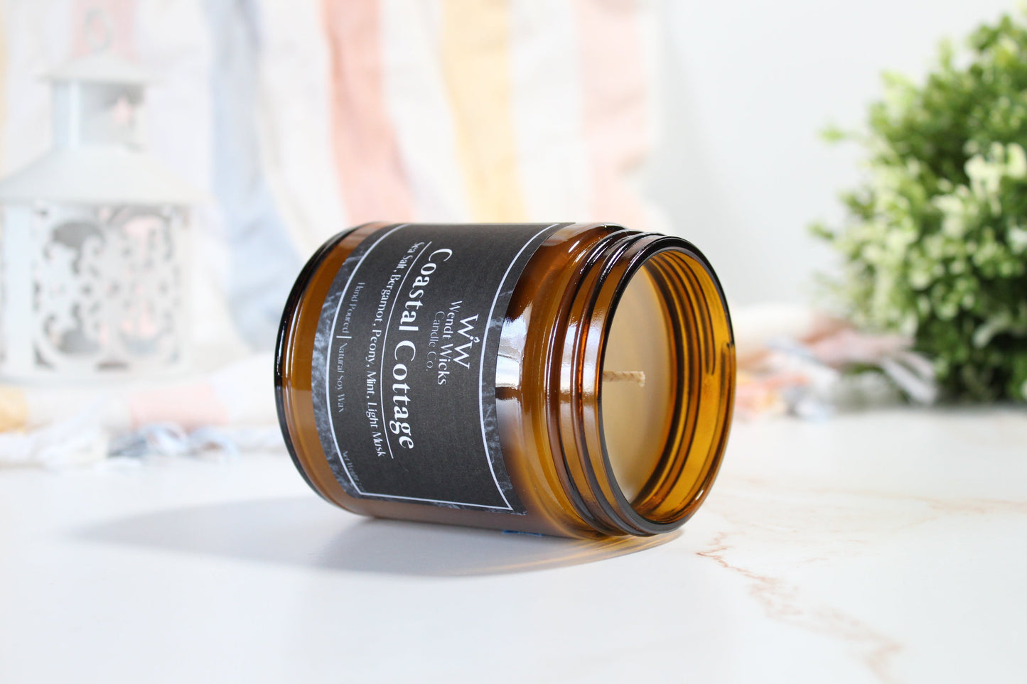 Brown jar with a label on a white surface
