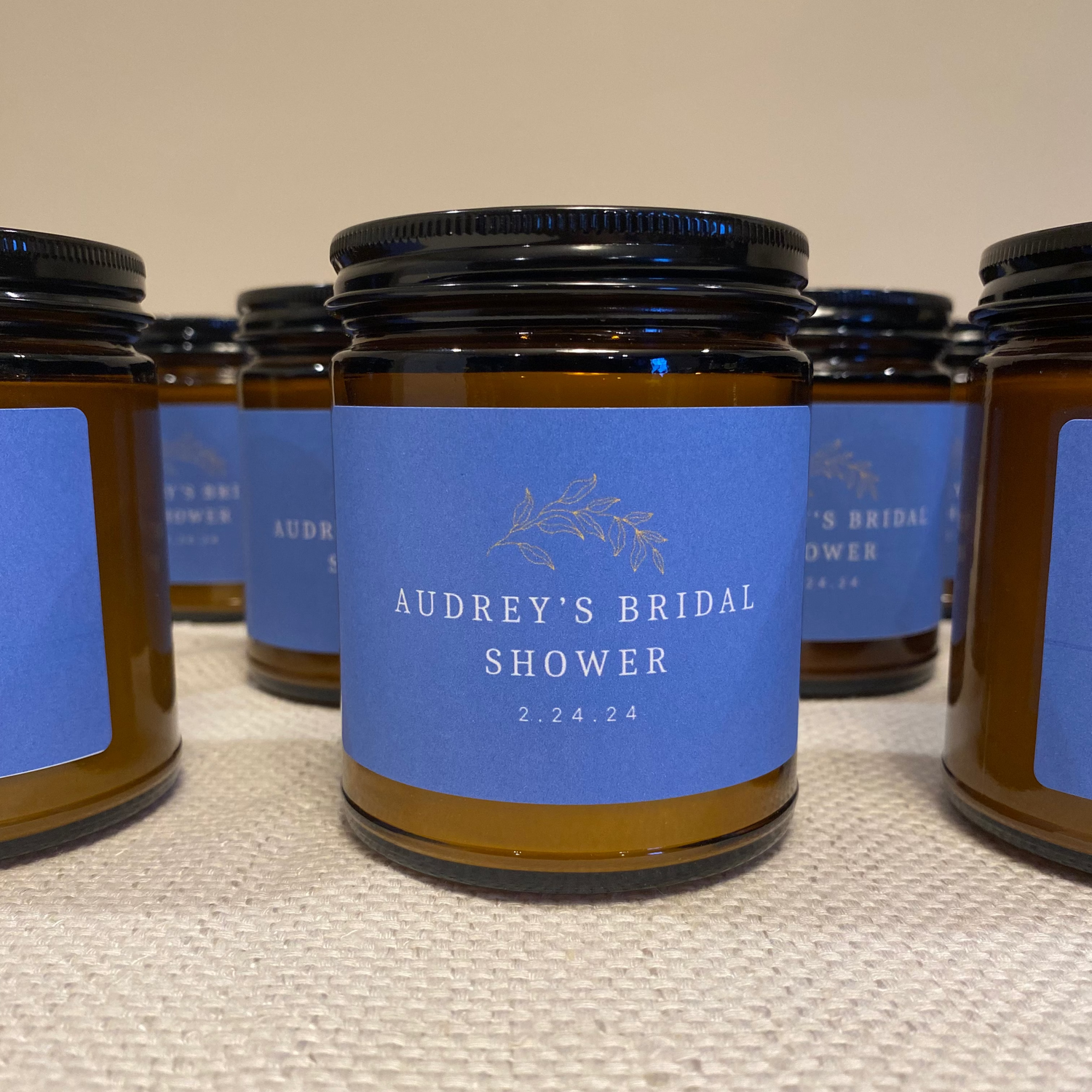 Image showing a Amber jar candle with a custom label for a Bridal Shower including the date and wedding colors