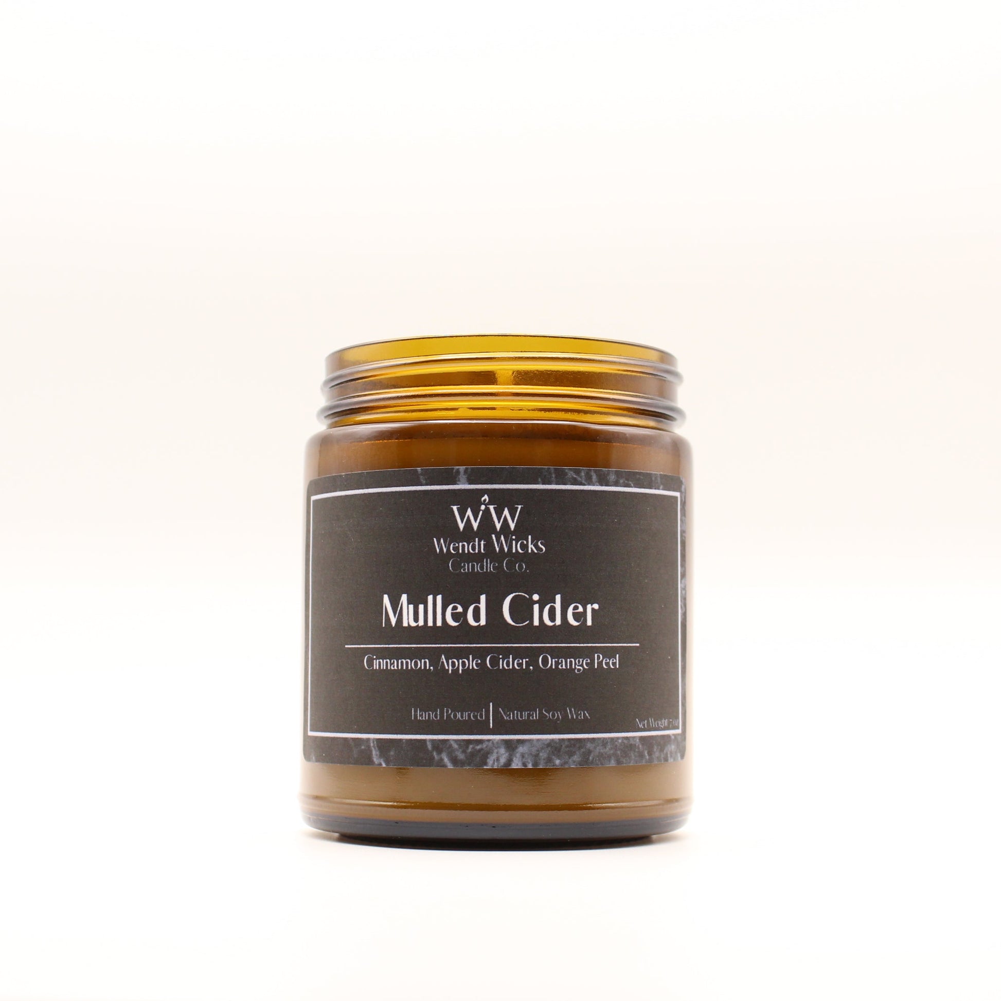 Wendt Wicks amber glass jar candle. Candle labeled 'Mulled Cider' on a white background