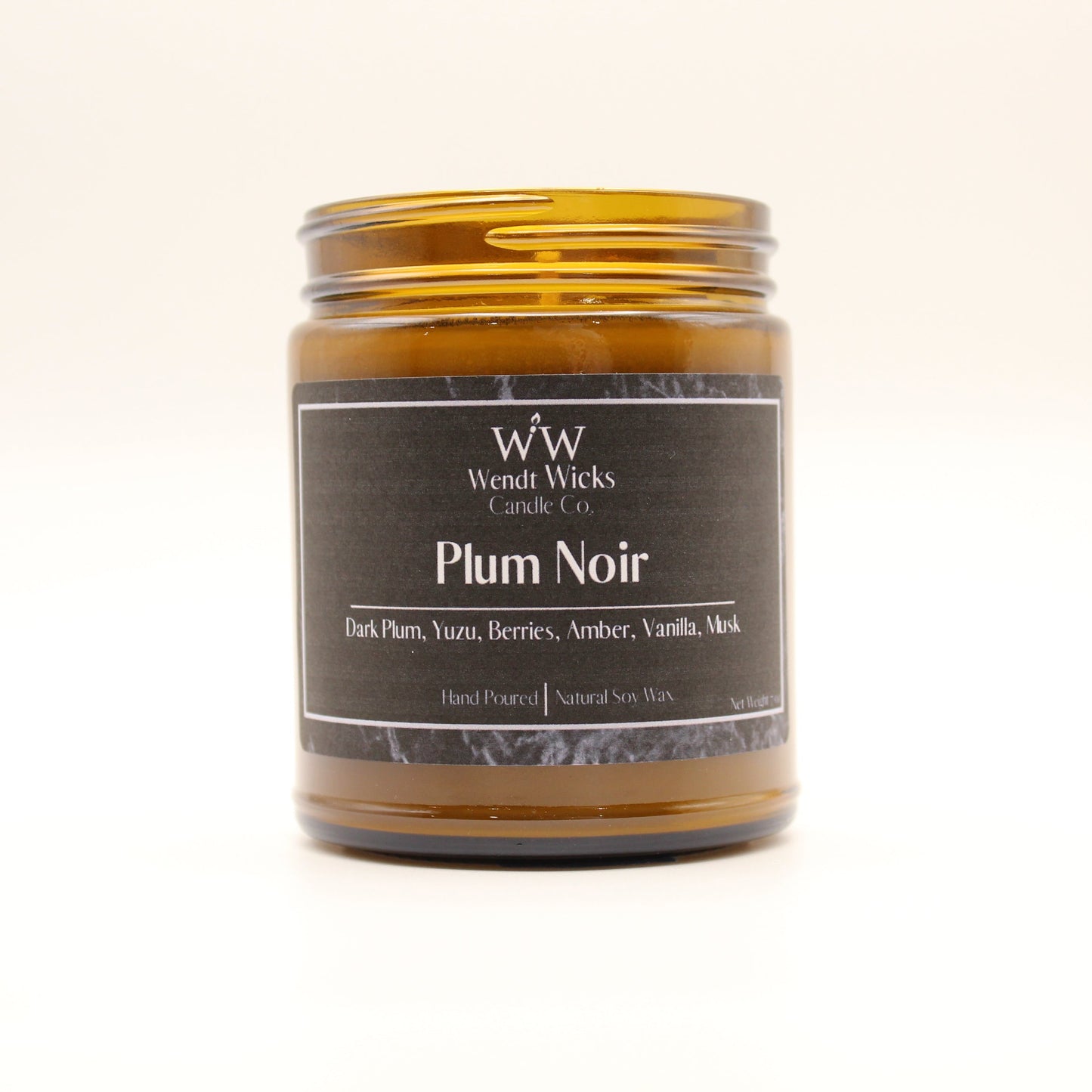 Wendt Wicks Plum Noir candle in a glass jar on a white background