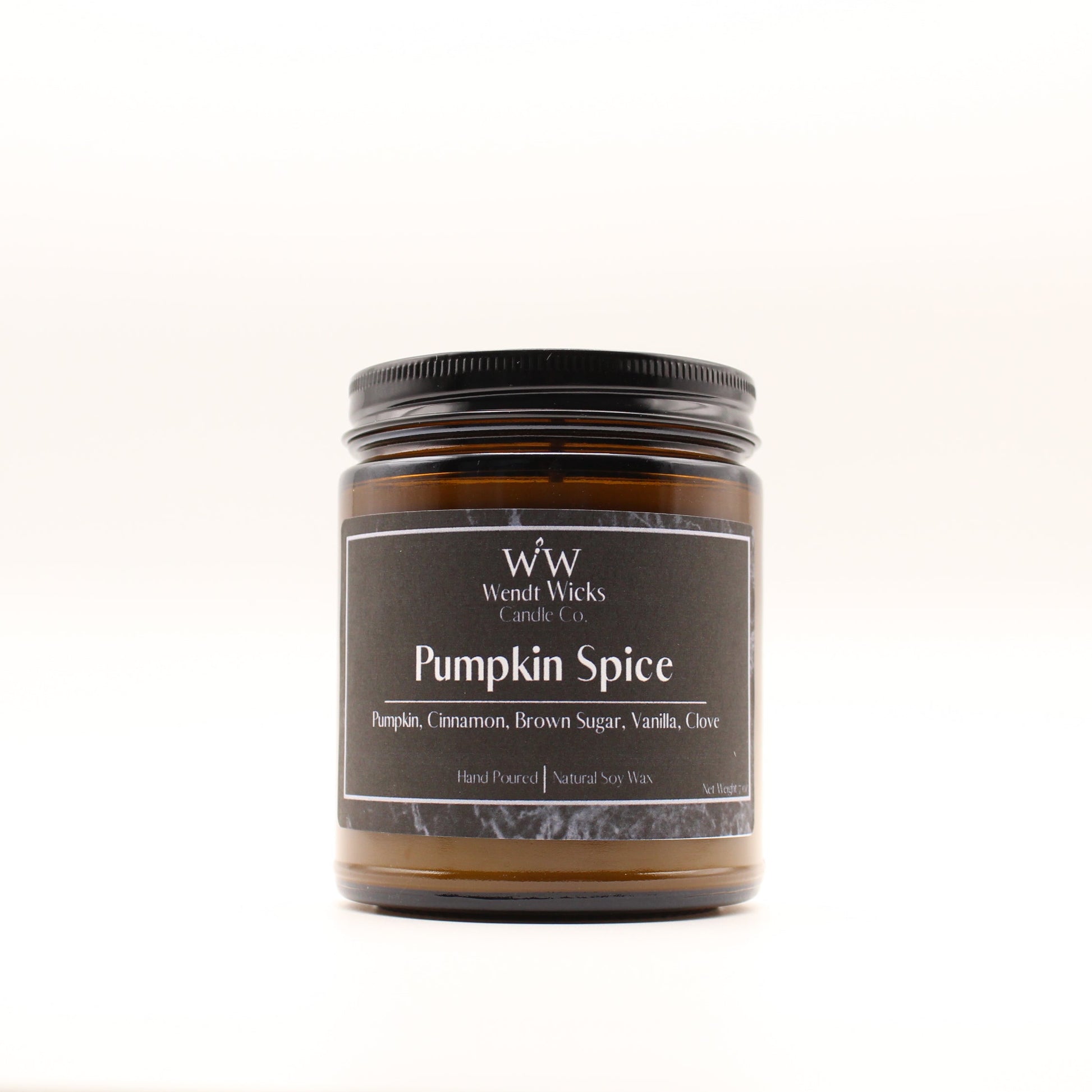 Wendt Wicks amber glass jar candle with black lid. Candle labeled 'Pumpkin Spice' on a white background